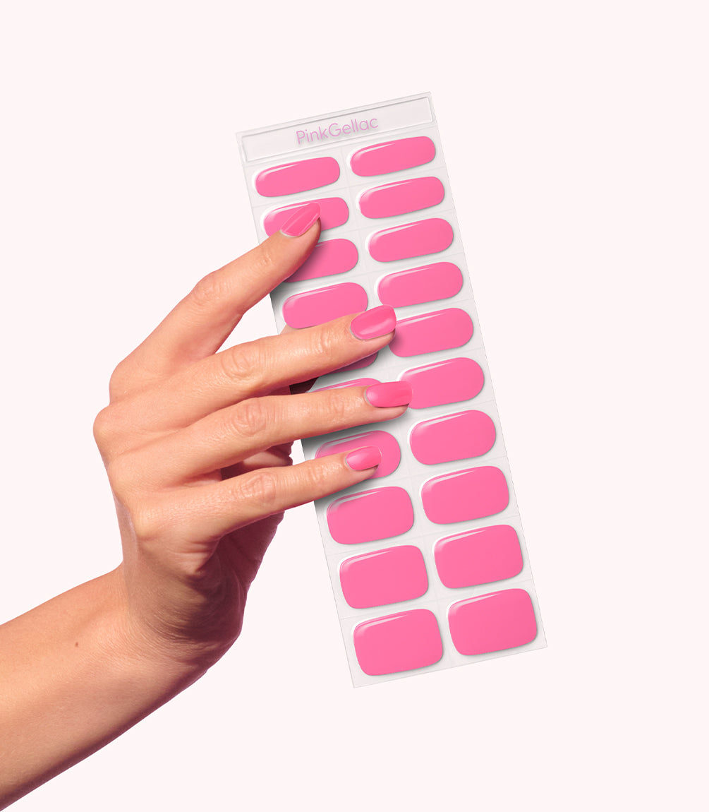 Hand wearing Pink Gellac 006 Neon Pink gel nail stickers.
