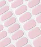 Pink oval nail stickers arranged in rows on a sheet.