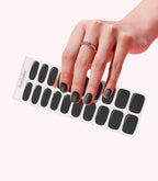 Hand wearing Pink Gellac 024 Jet Black gel nail stickers.