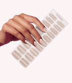 Hand wearing Pink Gellac 025 Cat Eye Champagne Gold gel nail stickers.