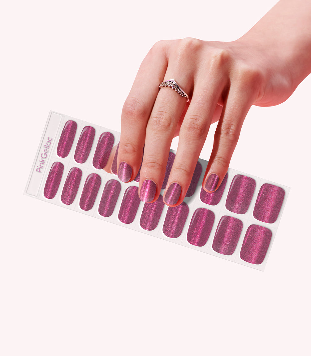 Hand wearing Pink Gellac 027 Cat Eye Flamenco Red gel nail stickers.
