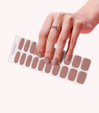 Hand wearing Pink Gellac 033 Earthy Brown gel nail stickers.