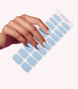 Hand wearing Pink Gellac 040 Powdery Blue gel nail stickers.