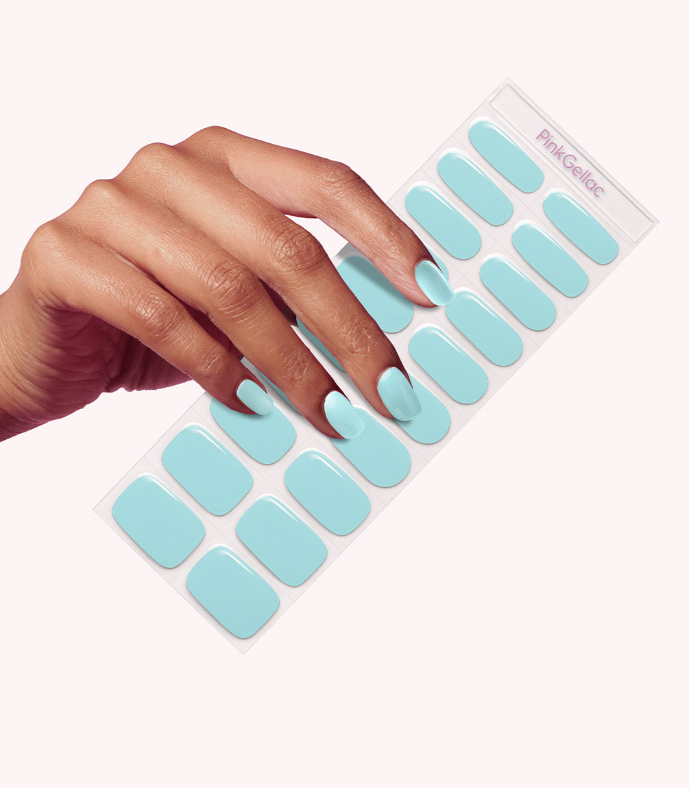Hand wearing Pink Gellac 046 Aquatic Mint gel nail stickers.