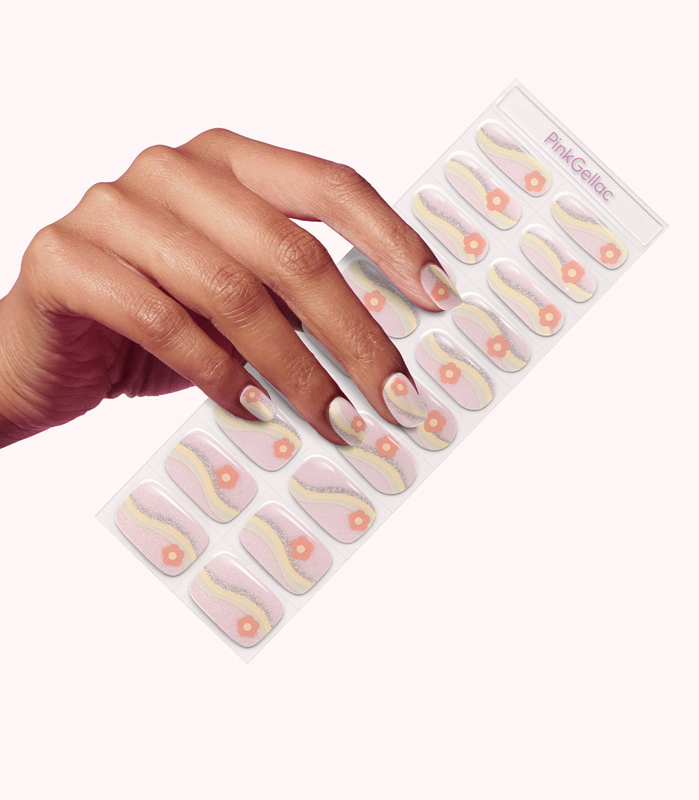 Hand wearing Pink Gellac 049 Blooming Meadows gel nail stickers.