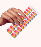 Hand wearing Pink Gellac 054 Rainbow Flow gel nail stickers.
