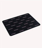 A black mat with repeated "Pink Gellac" logo in white letters against a white background.
