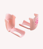 Two pink plastic clips on a white background.