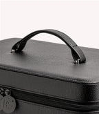 Black leather case with handle and zipper, partially exposed.