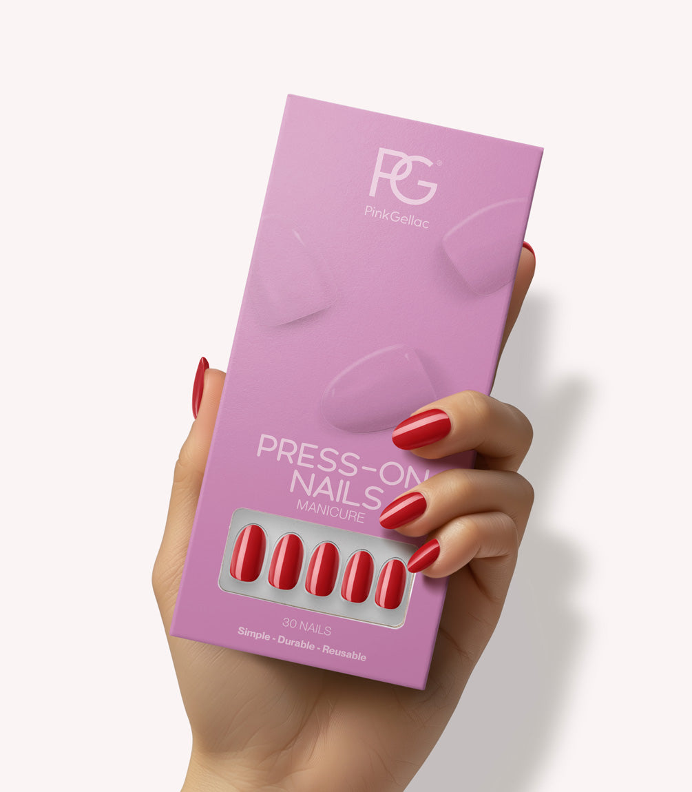 Hand holding Pink Gellac 109 Lipstick Red press-on nails in their packaging.