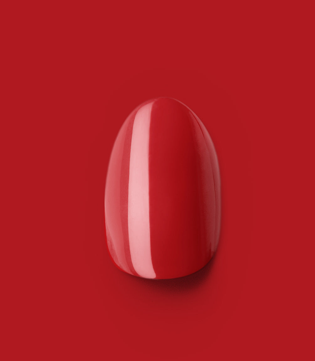 Close-up of a Pink Gellac 109 Lipstick Red press-on nail.