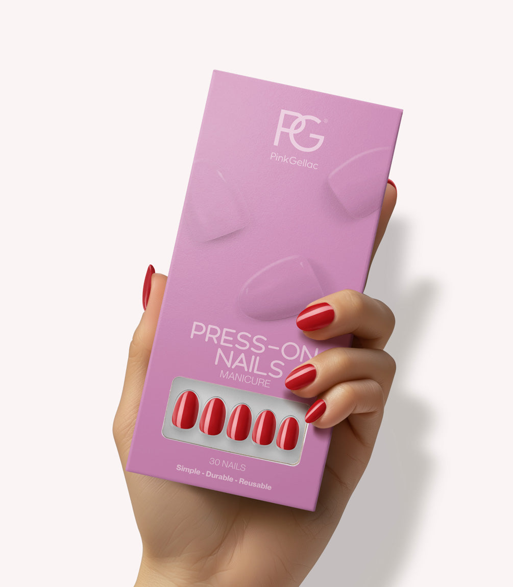 Hand holding Pink Gellac 109 Lipstick Red press-on nails in their packaging.