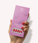 Hand holding Pink Gellac 109 Lipstick Red press-on nails in their packaging.