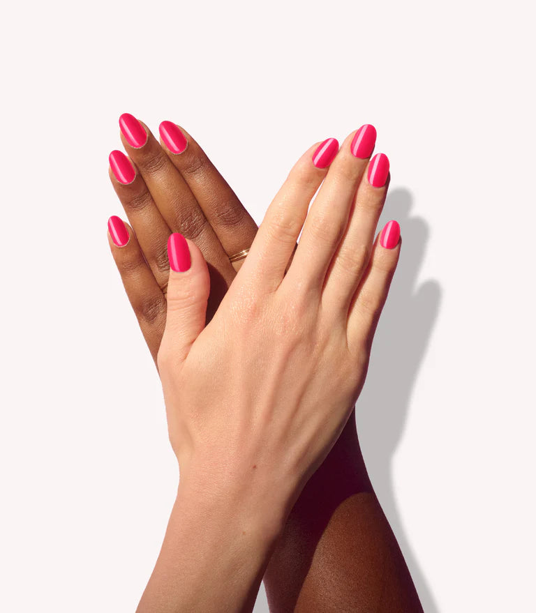 Hands wearing Pink Gellac 161 Ibiza Pink press-on nails.