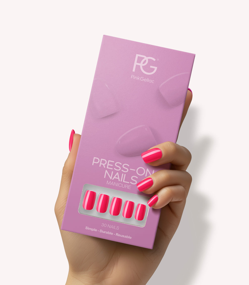 Hand holding Pink Gellac 161 Ibiza Pink press-on nails in their packaging.