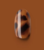Close-up of a Pink Gellac 2007 Tortoise Touch press-on nail.