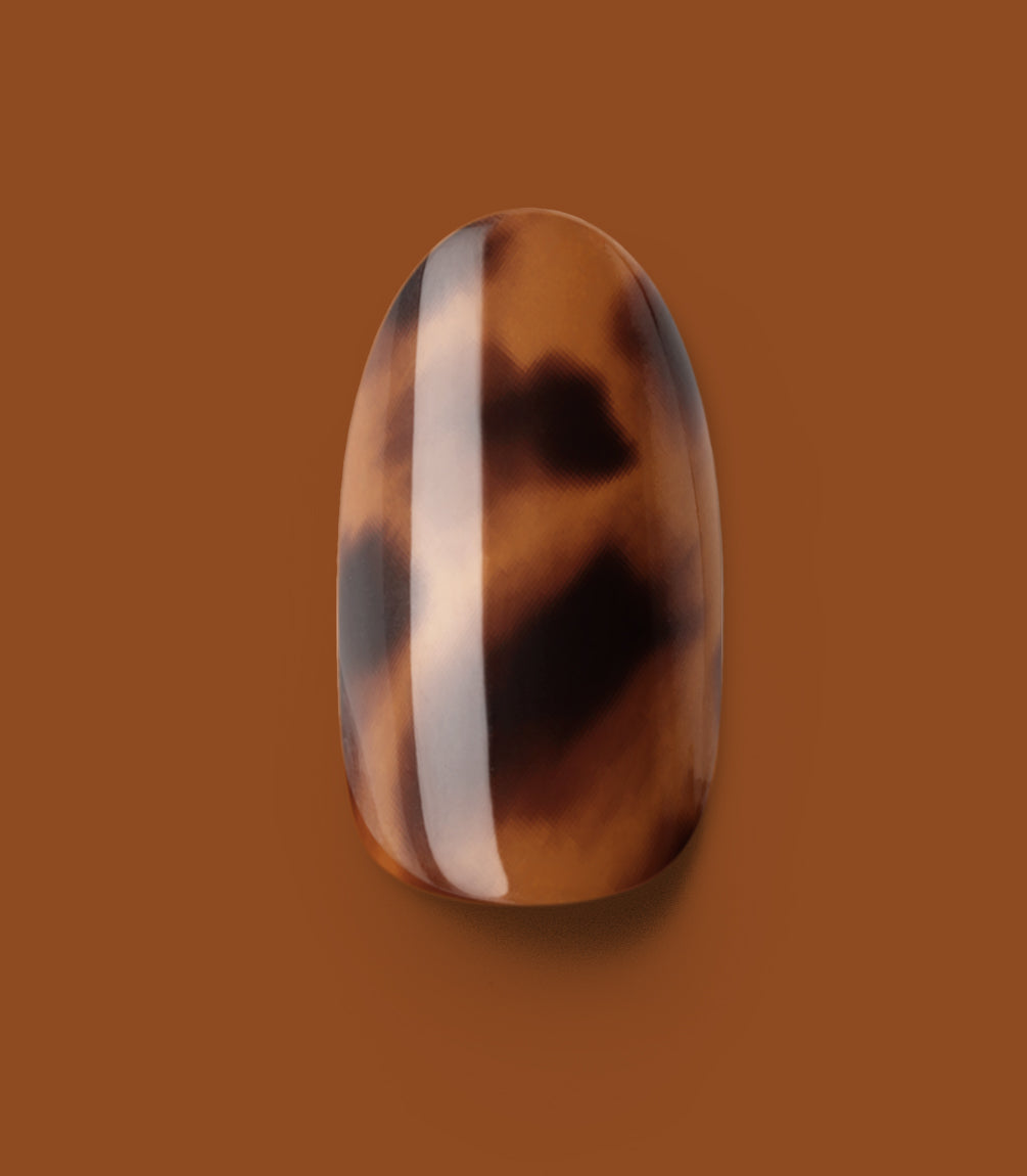 Close-up of a Pink Gellac 2007 Tortoise Touch press-on nail.