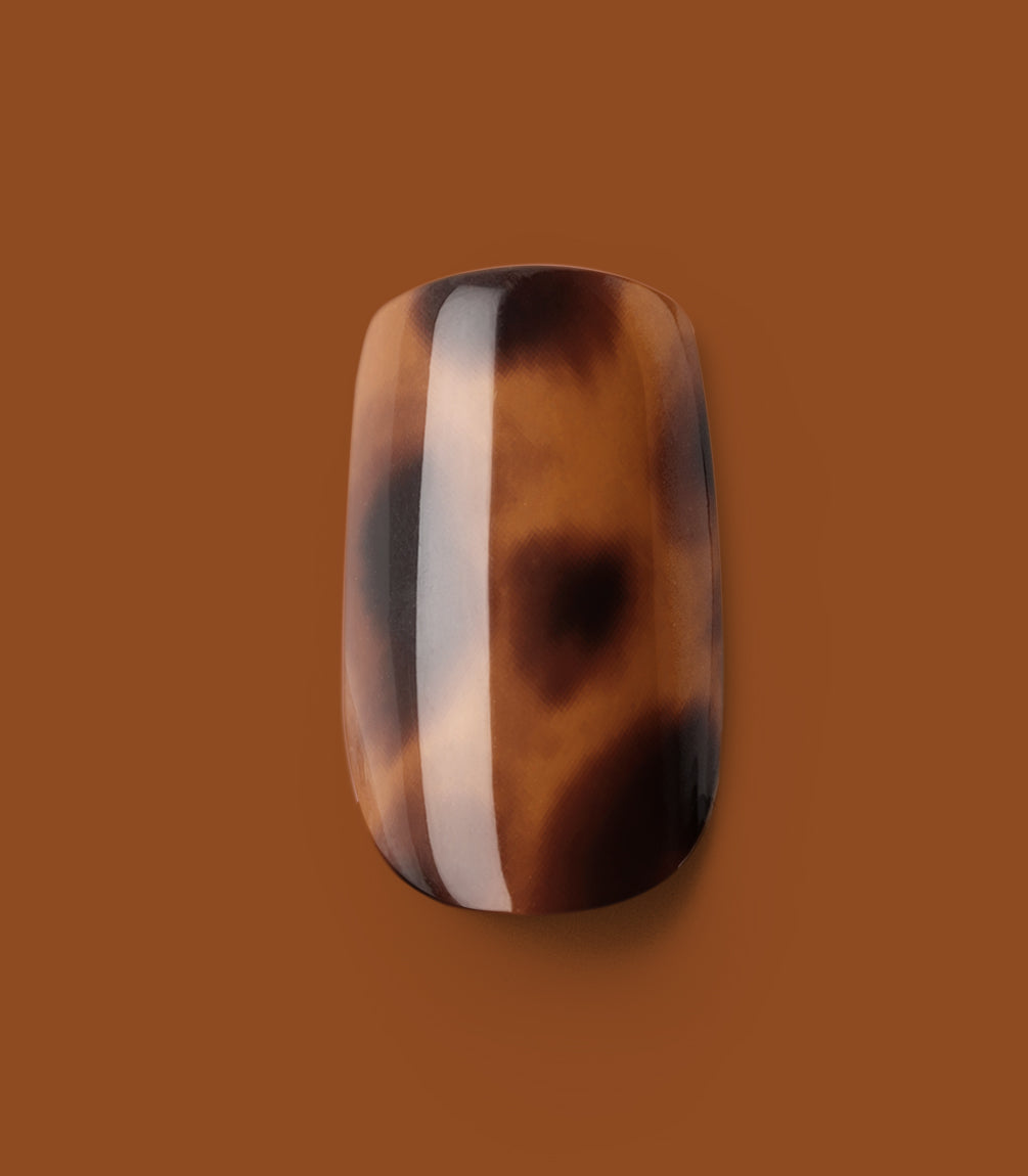 Close-up of a Pink Gellac 2007 Tortoise Touch press-on nail.