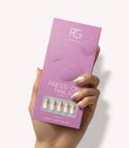 Hand holding Pink Gellac 2008 Glowing Gradient press-on nails in their packaging.