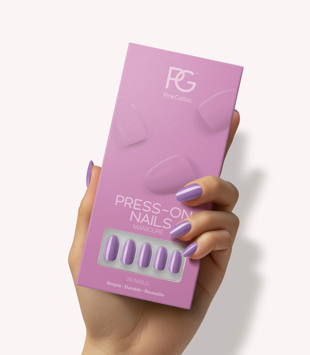 Hand holding Pink Gellac 324 Lotus Lila press-on nails in their packaging.
