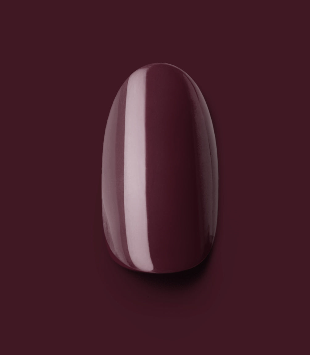 Close-up of a Pink Gellac 332 Sangria Red press-on nail.
