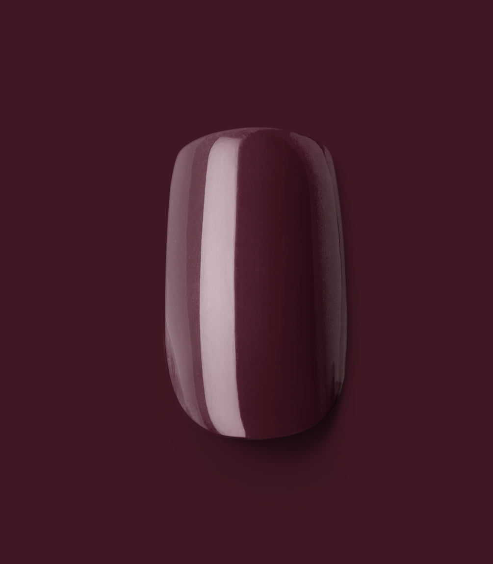 Close-up of a Pink Gellac 332 Sangria Red press-on nail.