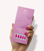 Hand holding Pink Gellac 368 Intense Plum press-on nails in their packaging.