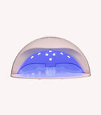 LED UV nail lamp with blue glow for curing gel polish.