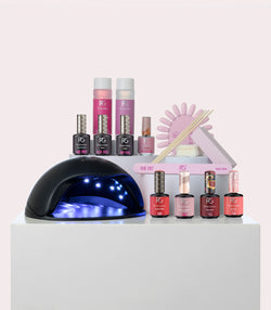 A display of various nail care products including a UV lamp, nail polish bottles, a nail file and other manicure supplies.