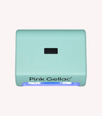 Mint green UV lamp for nail gel with brand name 'Pink Gellac' and blue UV light on the bottom.