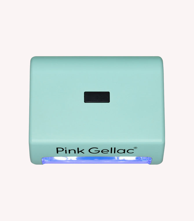 Mint green UV lamp for nail gel with brand name 'Pink Gellac' and blue UV light on the bottom.