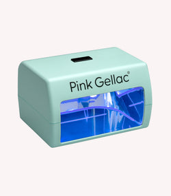 Green Pink Gellac UV lamp for nails with a blue glow on the inside.