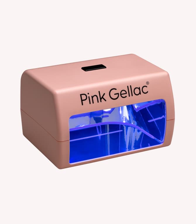 A pink UV lamp for nails with the text "Pink Gellac" printed on it, with a blue light glow inside.