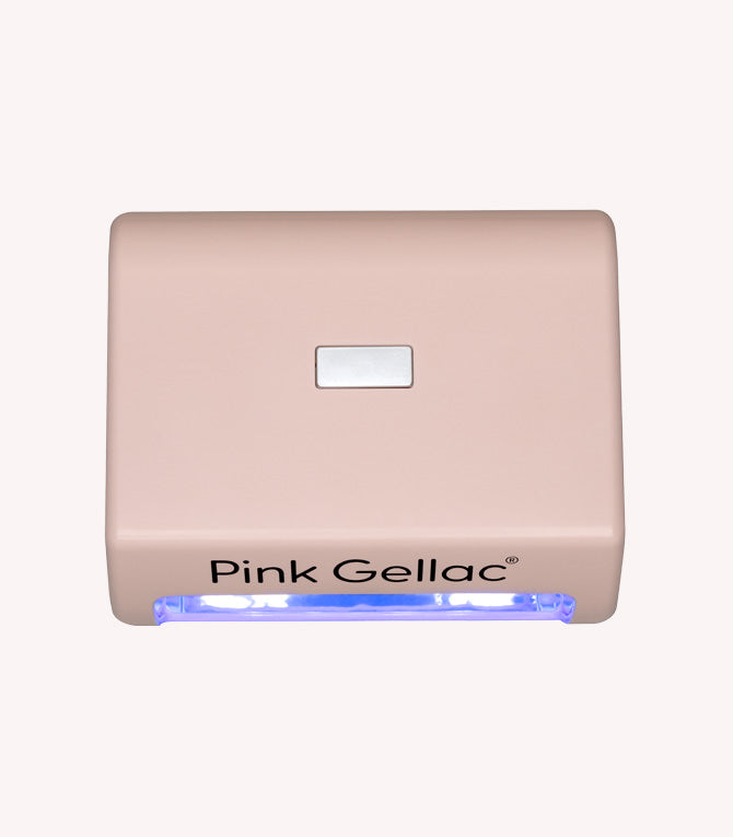 Beige nail lamp with brand name "Pink Gellac" and blue light.