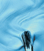 Close-up of a woman with Pink Gellac Effect coat Mermaid Blue manicured nails near her face.