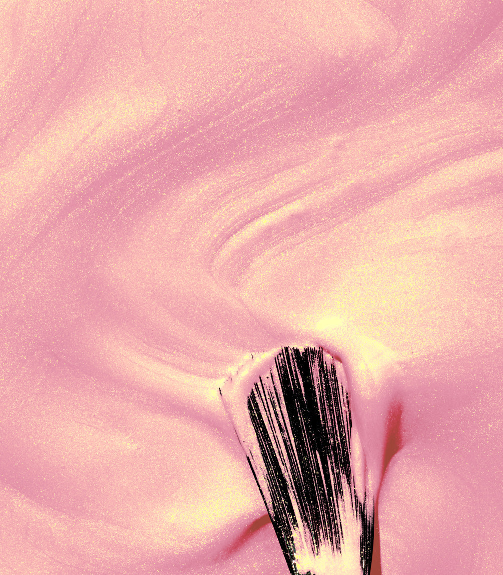Close-up of a woman with Pink Gellac Effect coat Twilight Pink manicured nails near her face.
