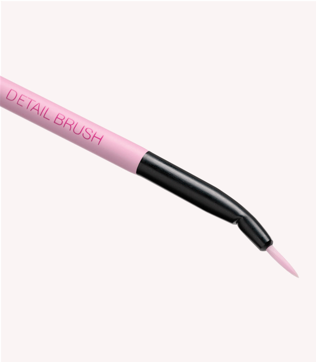 Pink detail brush with thin black neck and fine tip.