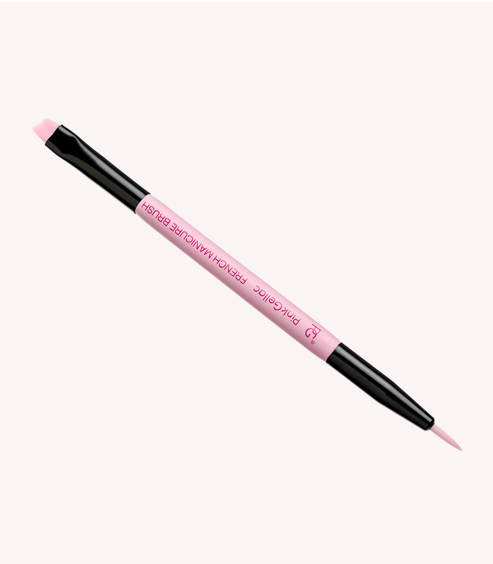 A double-sided nail brush with a pink handle and black handles, designed for manicures.