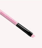 Pink and black French manicure brush with oblique bristles.