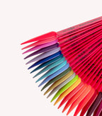 A range of nail polish colors in different shades, arranged on plastic color samples.