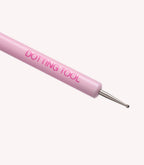 Pink dotting tool with metal tip for nail art.
