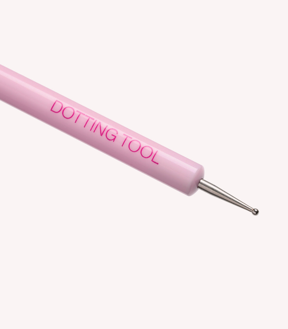 Pink dotting tool with metal tip for nail art.