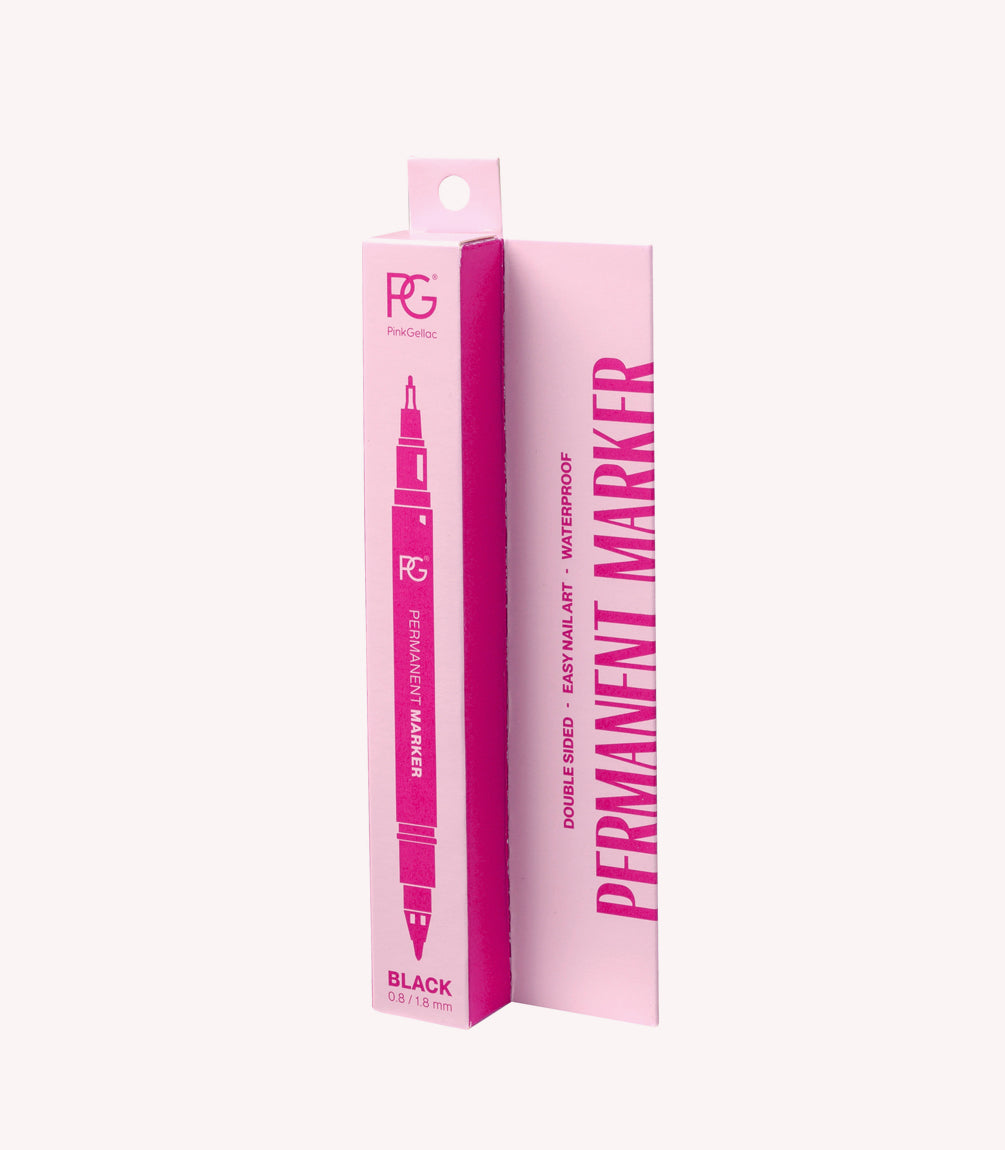 Pink packaging of a black permanent marker with a double tip, with text about the features such as "waterproof" and "easy nail art".