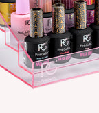 A pink acrylic stand with several bottles of Pink Gellac nail polish and care products.